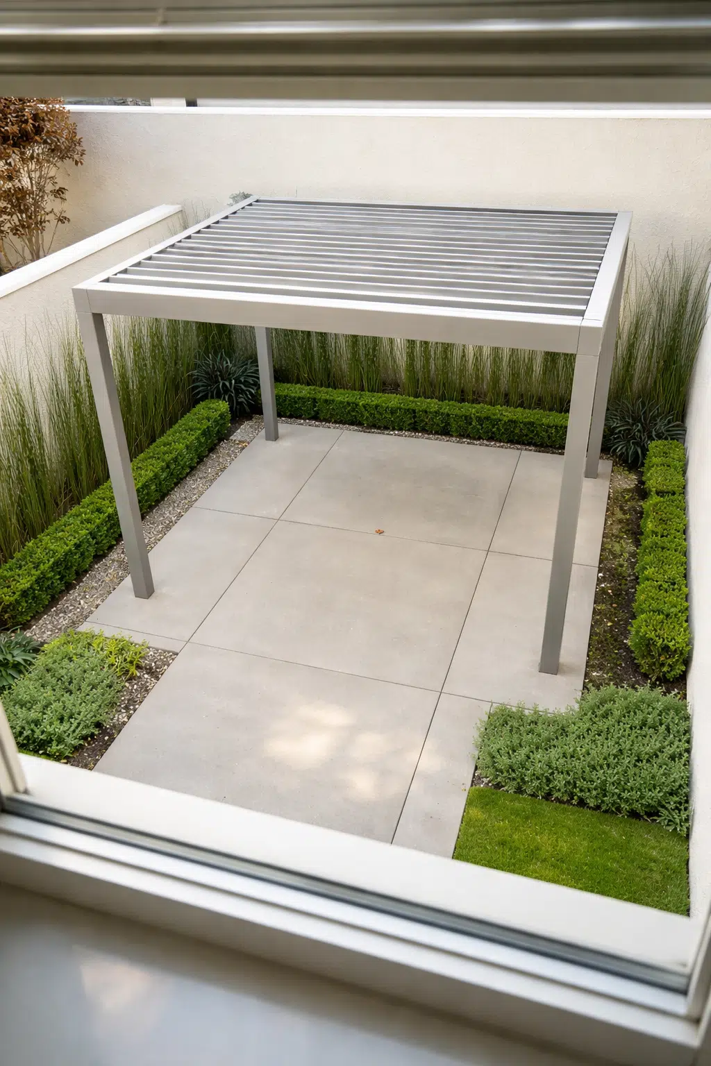 ### 13. Steel Pergola Over Boxwood-Edged Patio