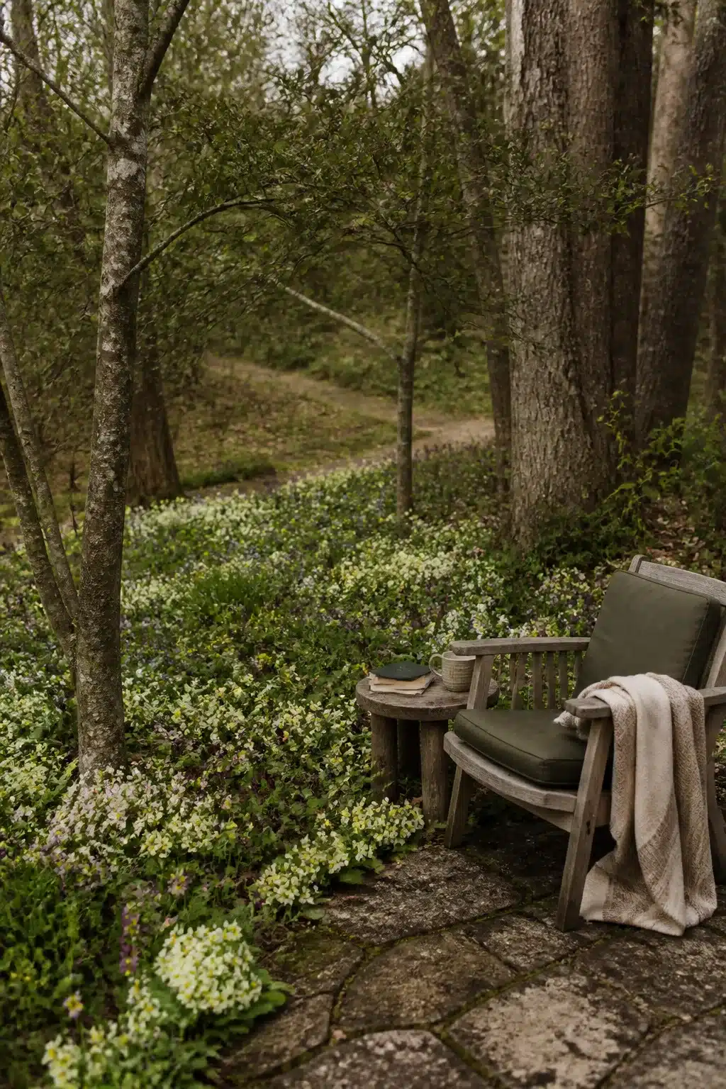White wildflower ground cover around a woodland garden stone patio seating area — Woodland Gardens With Colorful Flowers