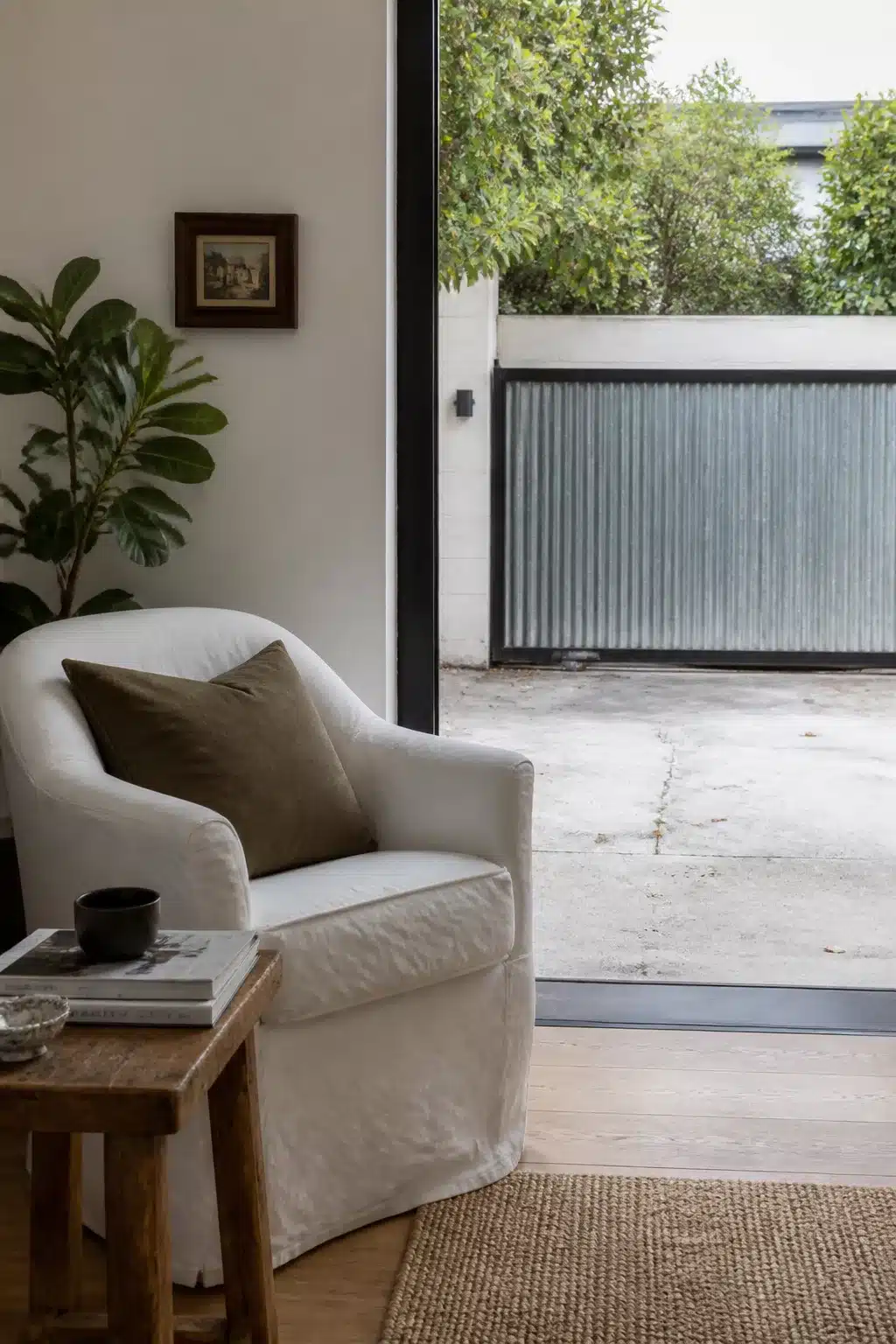 Corrugated zinc sliding driveway gate with concrete drive and white rendered walls — Driveway Gate Ideas